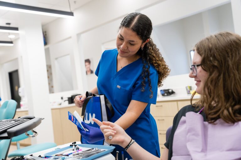 Teen patient choosing braces colors at Luv Braces in Hutto